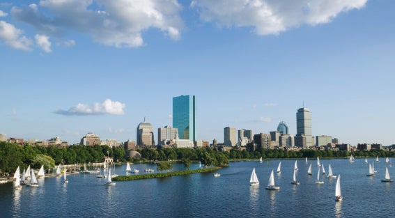 View of Back Bay and sail boats on Charles River in Boston during the summer.